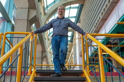 Professor Dan Brown on stairs in Davis Centre