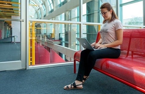 photo of Alexandra Vtyurina with laptop computer in Davis Centre