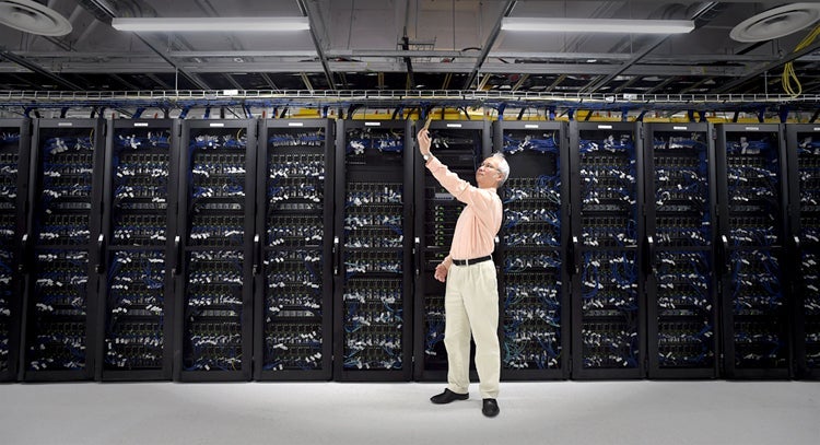 photograph of Justin Wan with Graham computer