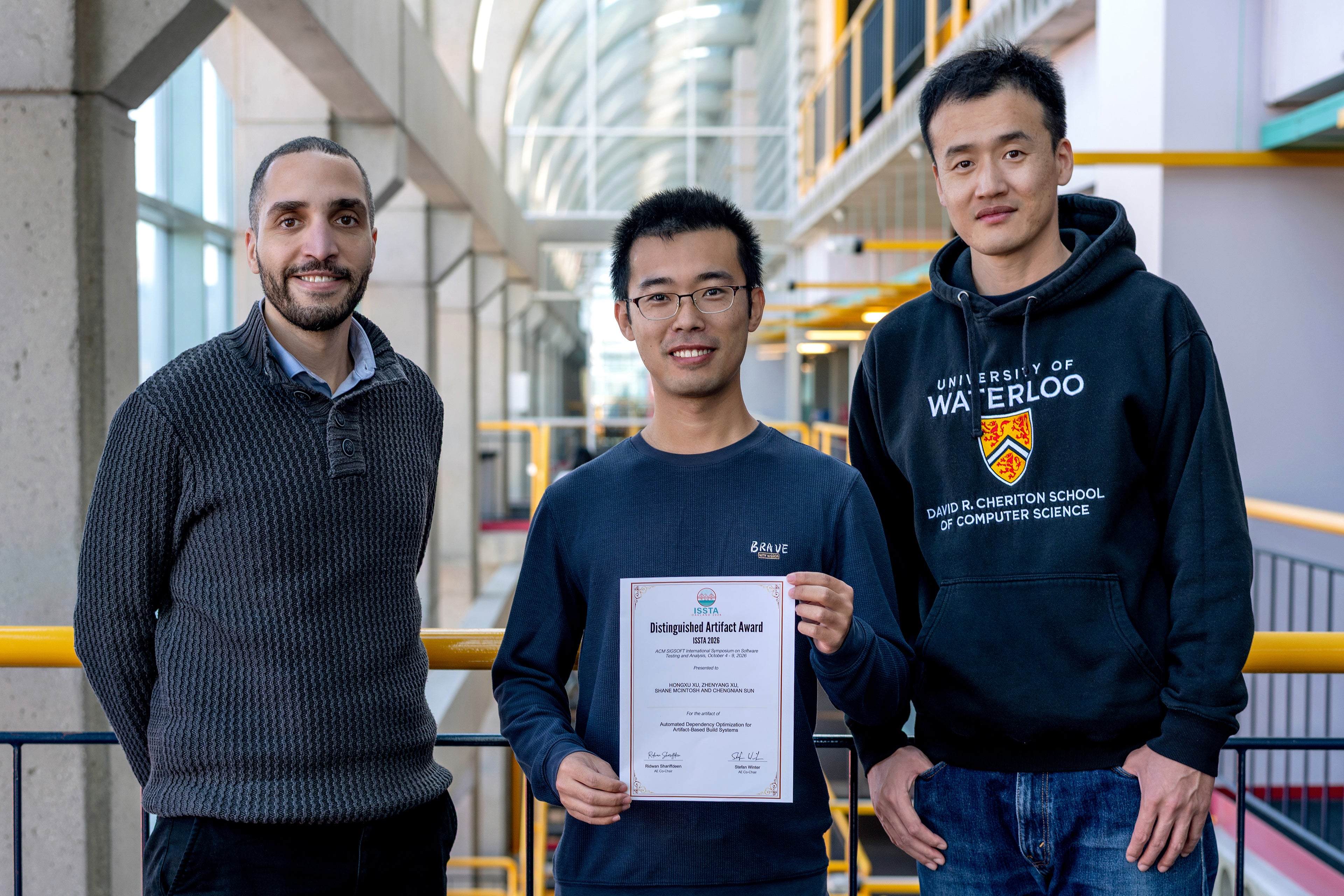 Left to right: Professor Shane McIntosh, PhD candidate Hongxu Xu, Professor Chengnian Sun